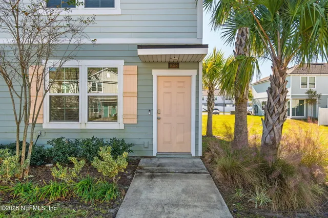 a kitchen with stainless steel appliances a sink and a refrigerator
