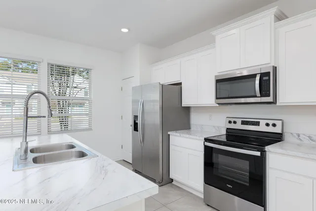 a bathroom with a sink a vanity and mirror
