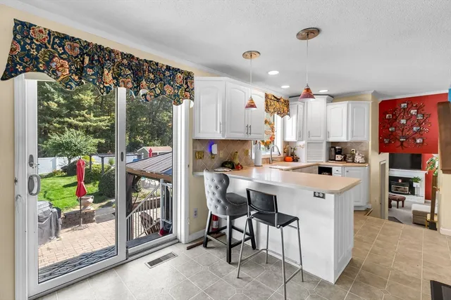 a kitchen with stainless steel appliances a stove a sink and a refrigerator