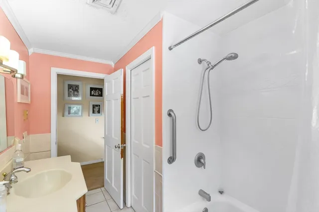 a bathroom with a sink and shower