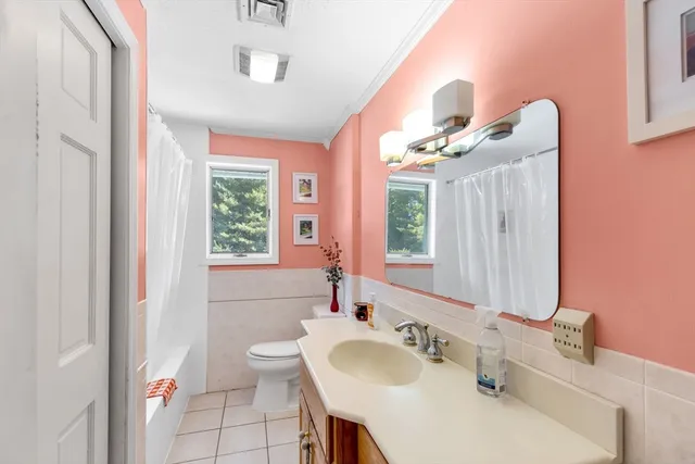 a bathroom with a sink vanity and a mirror