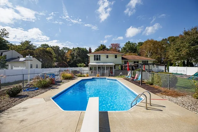 a view of a swimming pool with a lounge chairs