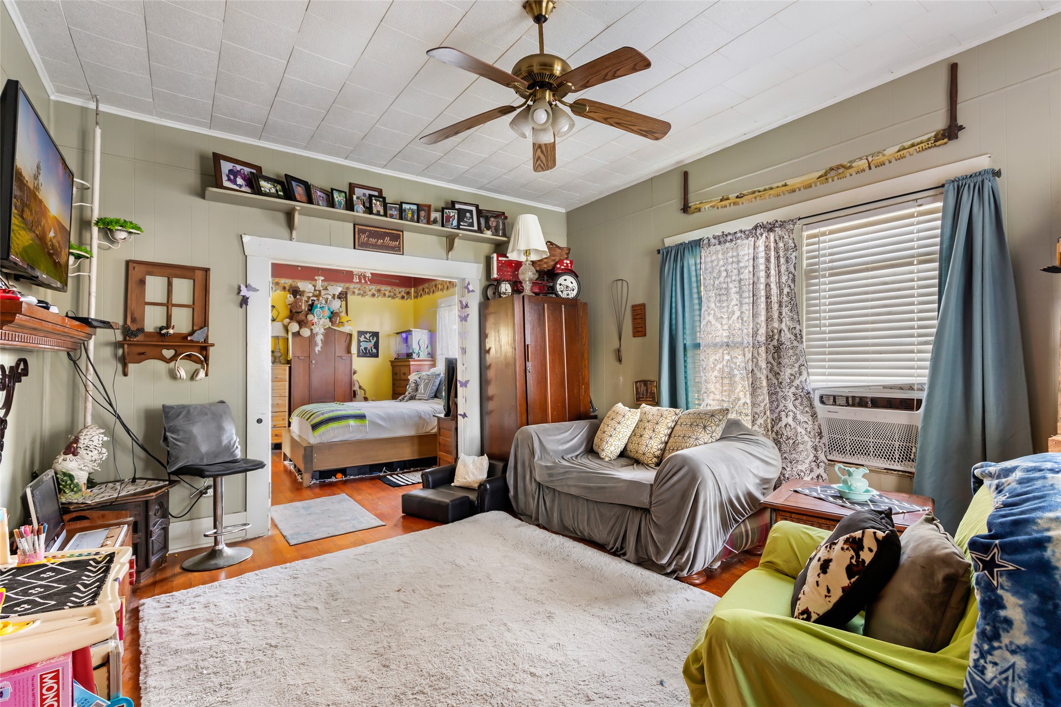 200 East Linney Street, Unit 202 Dayton, TX 77535 - Photo 11 of 22 a living room with furniture ceiling fan and a window