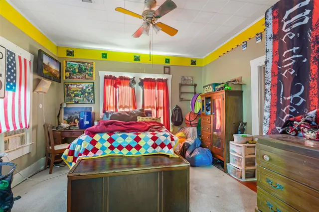 a view of a kitchen with stainless steel appliances granite countertop a stove and a wooden floors
