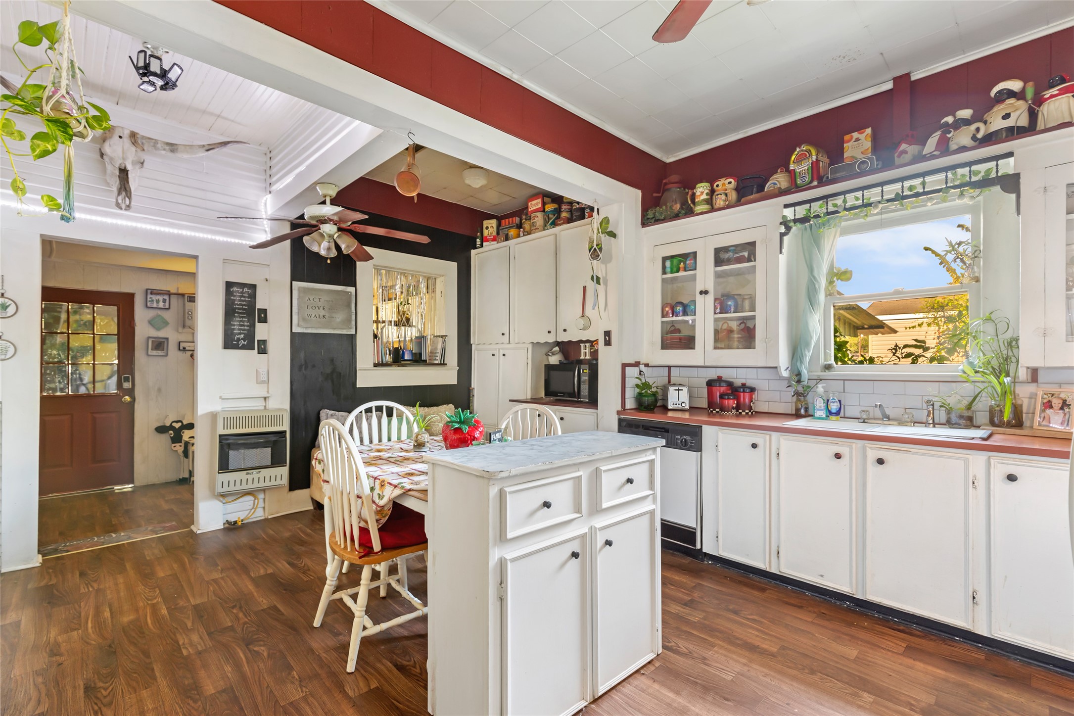200 East Linney Street, Unit 202 Dayton, TX 77535 - Photo 16 of 22 a view of a kitchen with stainless steel appliances granite countertop a stove and a wooden floors