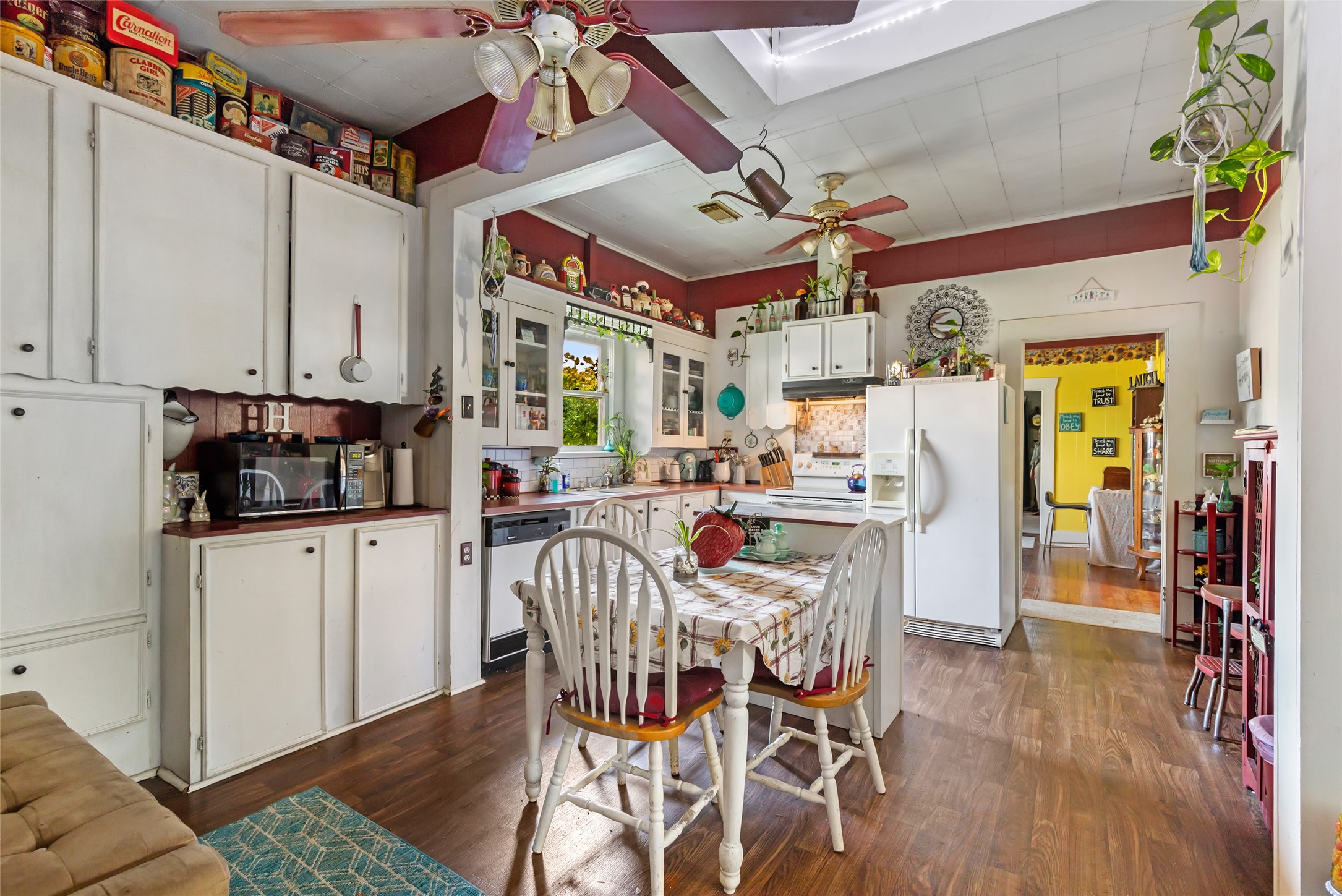 200 East Linney Street, Unit 202 Dayton, TX 77535 - Photo 18 of 22 a dining room with stainless steel appliances kitchen island granite countertop a table and chairs in it