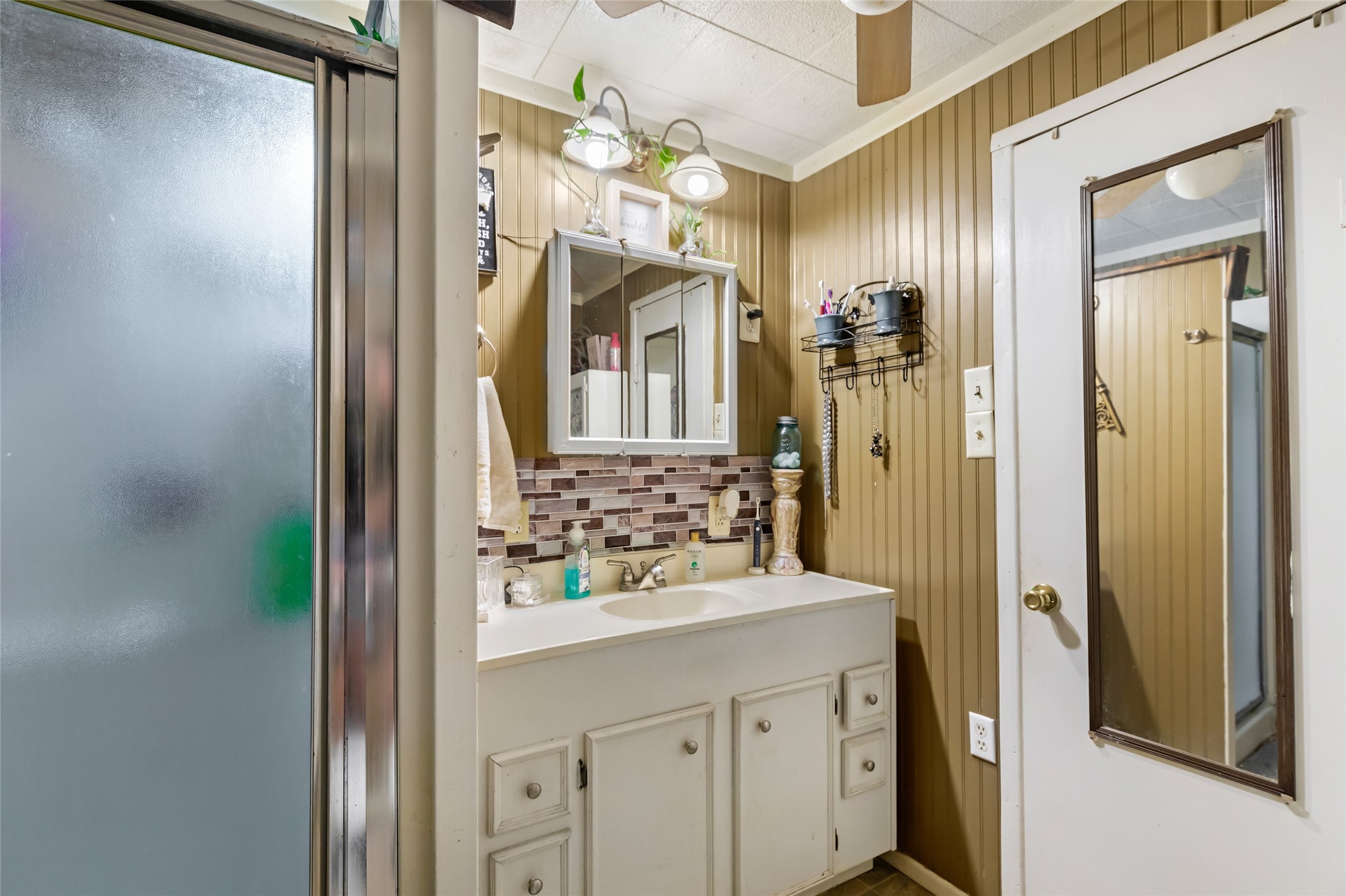 200 East Linney Street, Unit 202 Dayton, TX 77535 - Photo 22 of 22 a bathroom with a sink vanity and a mirror