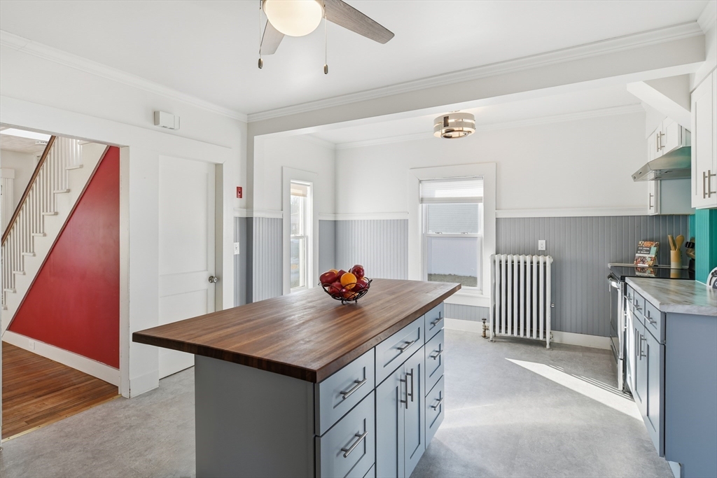 1201 Allen Street Springfield, MA 01118 - Photo 13 of 42 a living room with stainless steel appliances furniture cabinets and wooden floor