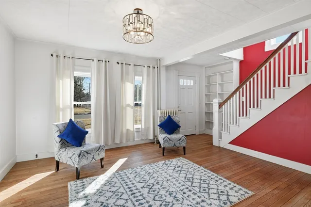 a living room with furniture and a rug