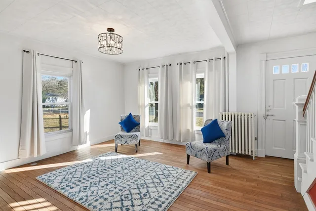a living room with furniture and a rug