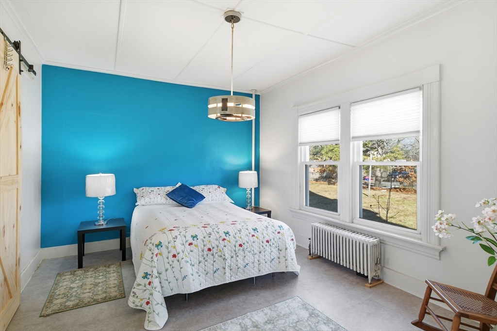 1201 Allen Street Springfield, MA 01118 - Photo 19 of 42 a bedroom with a bed and a window