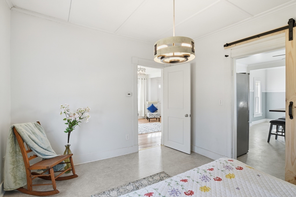 1201 Allen Street Springfield, MA 01118 - Photo 21 of 42 a view of a dining room with furniture and wooden floor