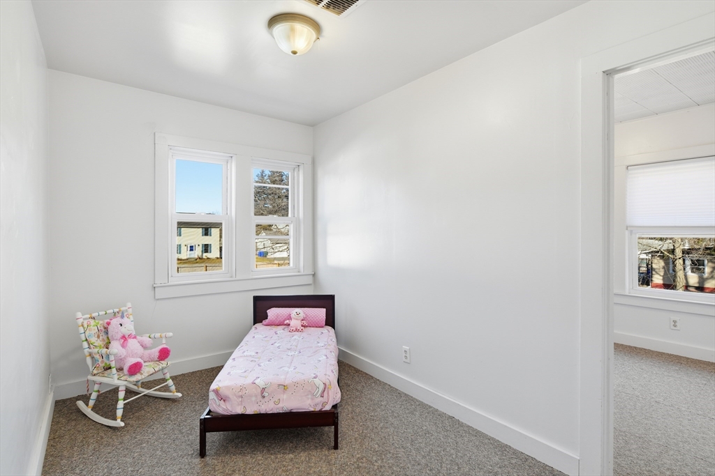 1201 Allen Street Springfield, MA 01118 - Photo 28 of 42 a room with a baby bed furniture and a window