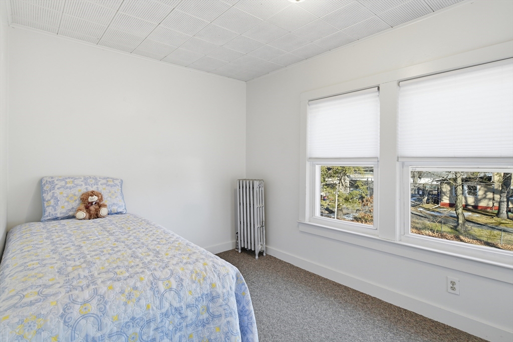 1201 Allen Street Springfield, MA 01118 - Photo 29 of 42 a bedroom with a bed and a large window
