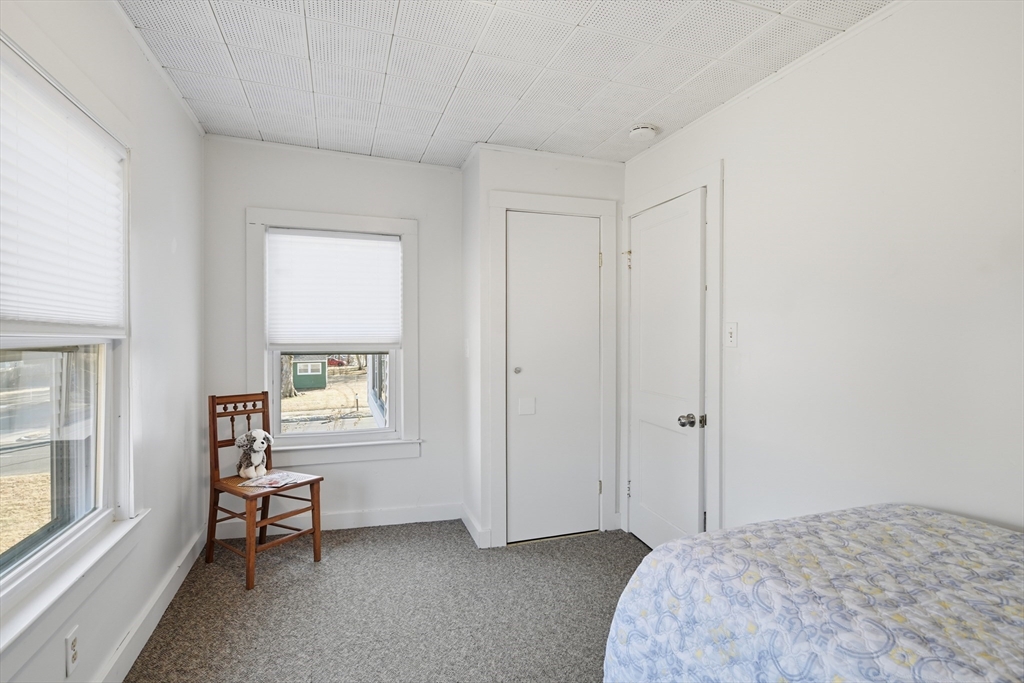 1201 Allen Street Springfield, MA 01118 - Photo 30 of 42 a bedroom with a bed and a window