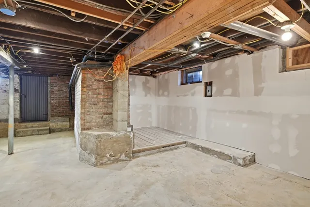a view of a room with wooden walls