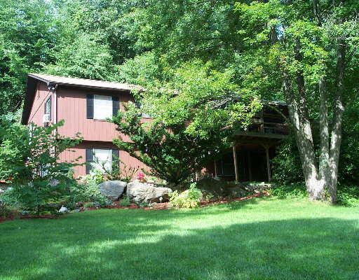 207 Hanover Road Newtown, CT 06470 - Photo 1 of 1 a front view of house with yard and green space