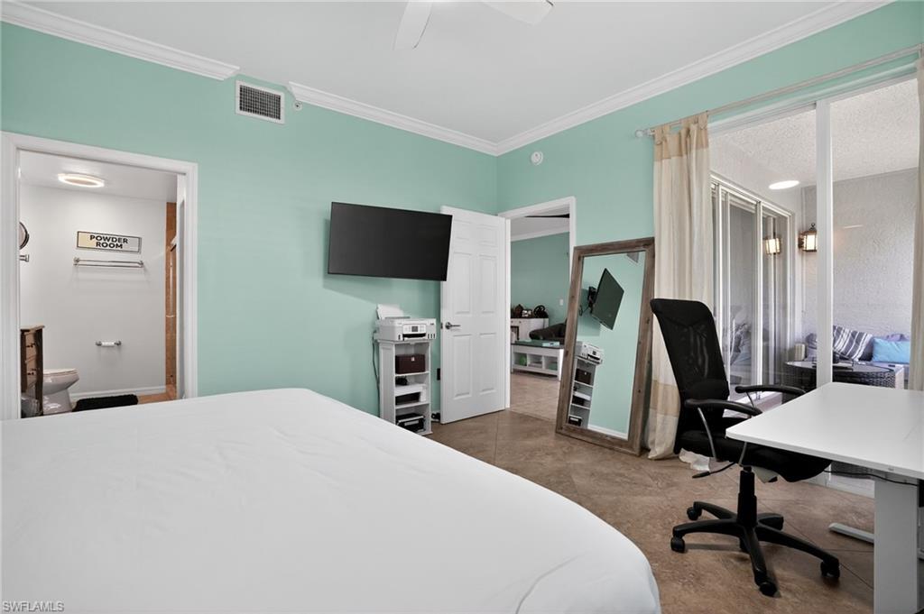 519 Roma Court, Unit 3101 Naples, FL 34110 - Photo 18 of 30 a bedroom with a workspace
