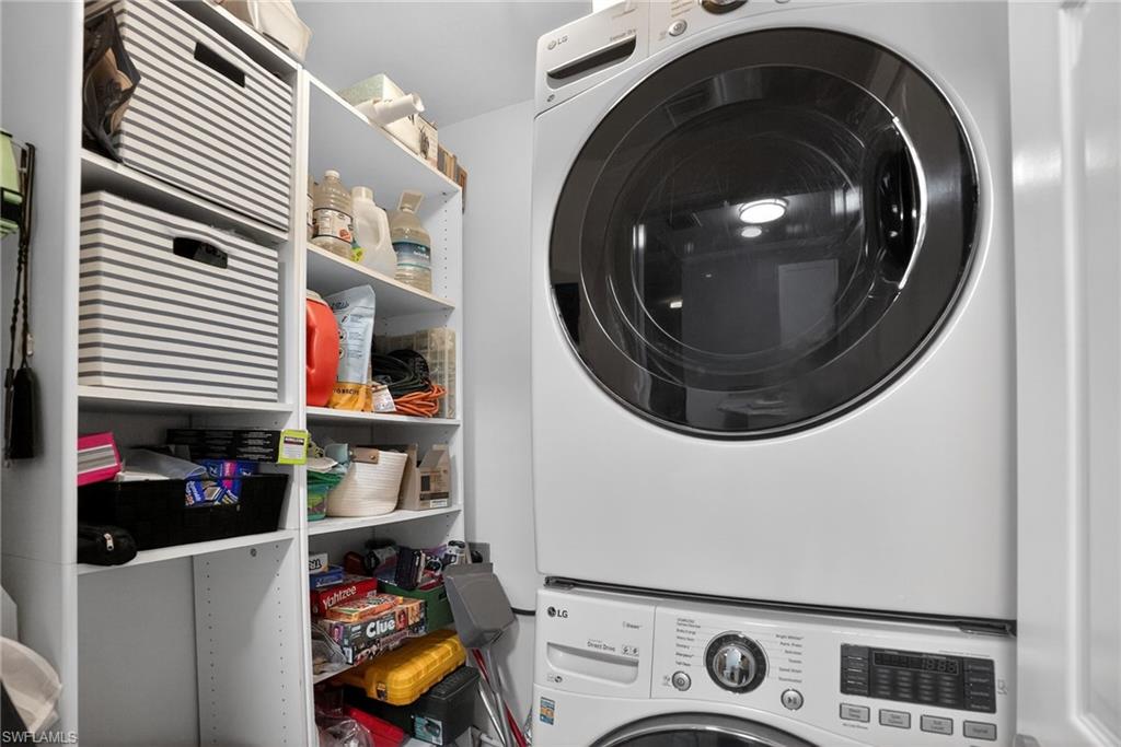 519 Roma Court, Unit 3101 Naples, FL 34110 - Photo 26 of 30 a utility room with dryer and washer