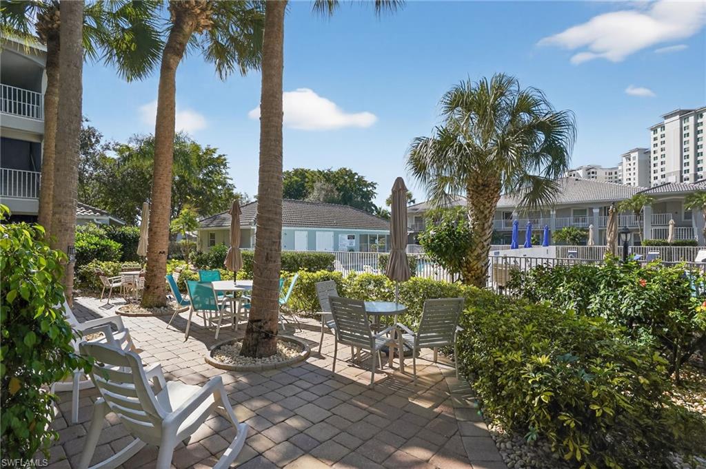 519 Roma Court, Unit 3101 Naples, FL 34110 - Photo 30 of 30 a view of an chairs and table in patio