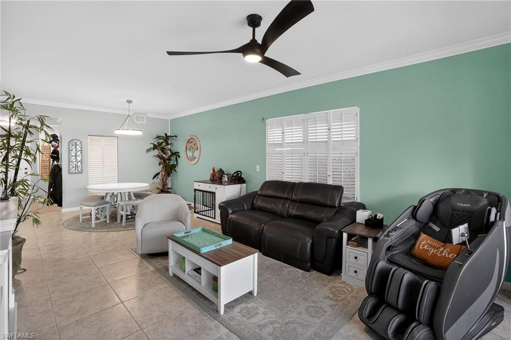 519 Roma Court, Unit 3101 Naples, FL 34110 - Photo 5 of 30 a living room with furniture and a window