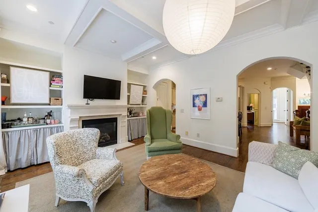 a view of a roof deck with table and chairs and wooden floor