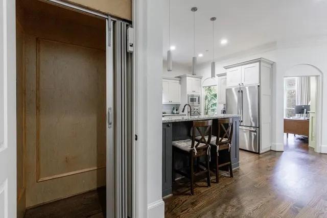 a bedroom with furniture and a flat screen tv