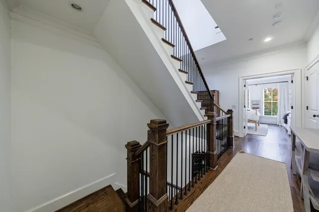 a spacious bedroom with a bed and a flat screen tv