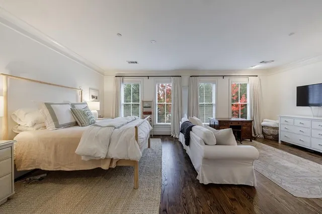 a view of a livingroom with furniture and mirror