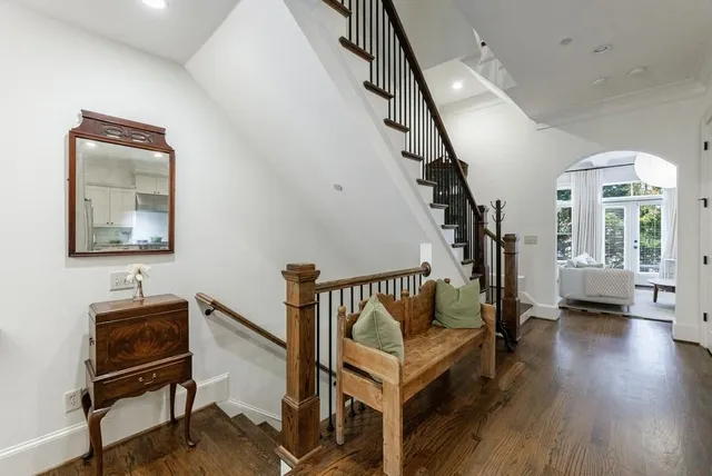 a view of entryway and hall with wooden floor