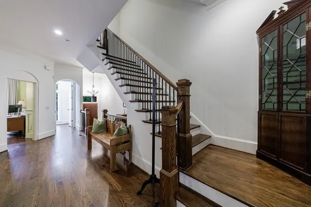 a view of a hallway view with wooden floor and staircase