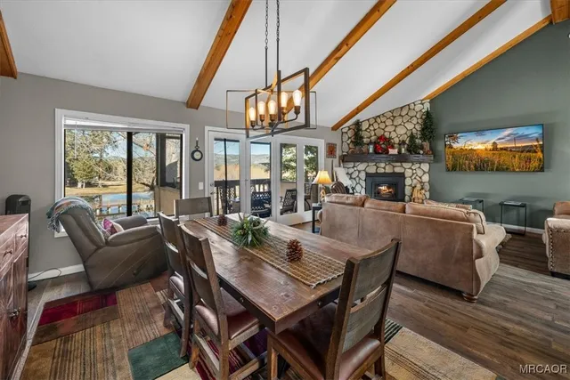 a dining room with furniture and wooden floor