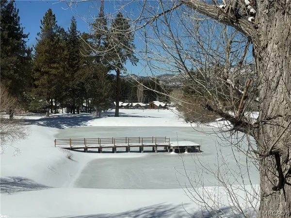 a view of a balcony with wooden floor