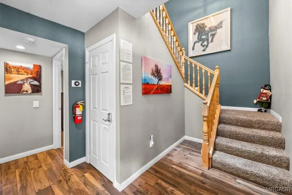 a kitchen with stainless steel appliances granite countertop a stove sink and microwave