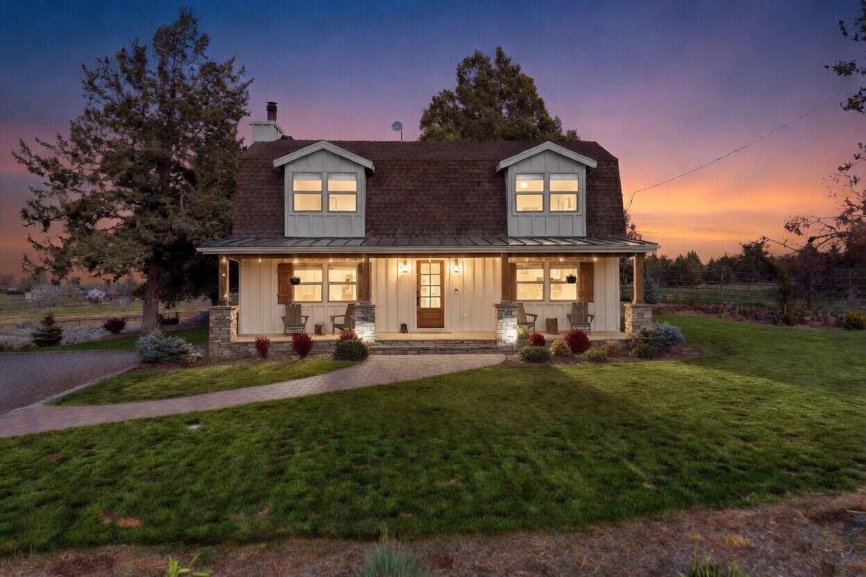 61280 Larsen Road Bend, OR 97702 - Photo 57 of 58 a front view of a house with a garden and porch