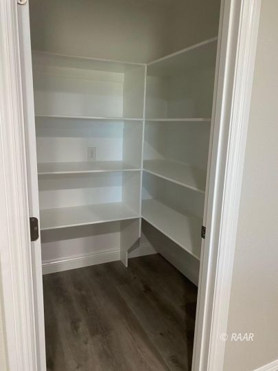 1124 South Yorktown Street Ridgecrest, CA 93555 - Photo 5 of 13 a view of walk in closet with empty racks