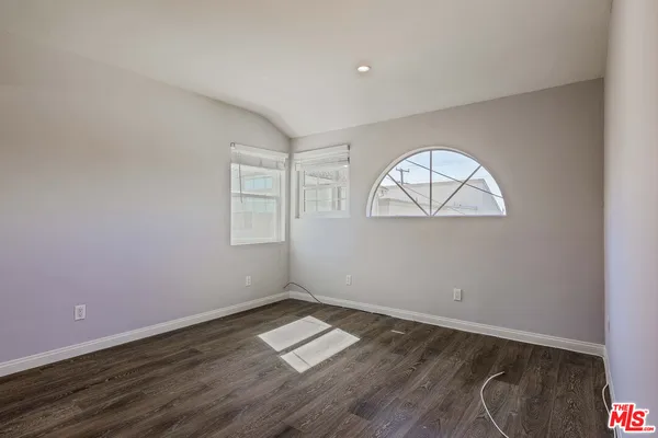 a kitchen with stainless steel appliances granite countertop a refrigerator sink and stove