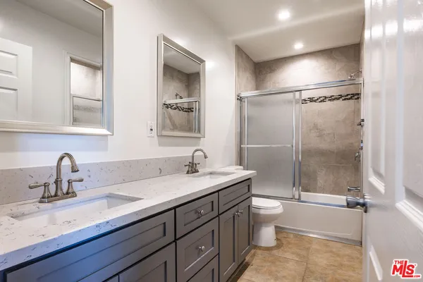 a bathroom with a shower and a toilet