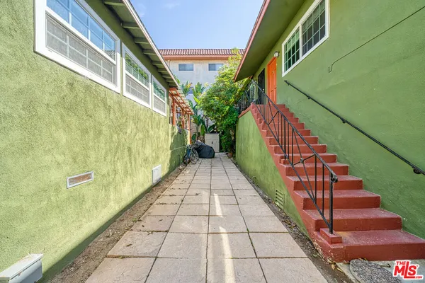 a view of a backyard with sitting area