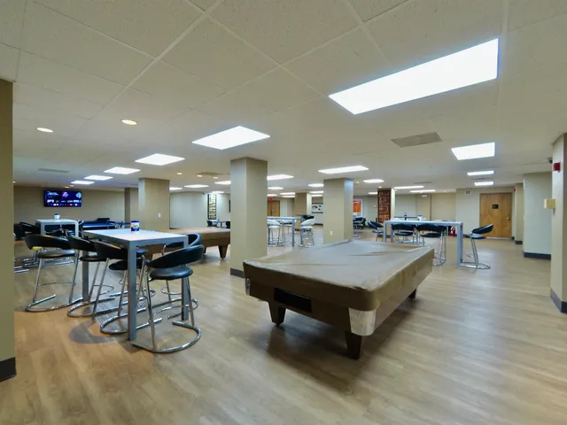 a room with lots of furniture and a table