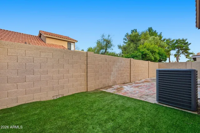 a backyard of a house with lots of green space