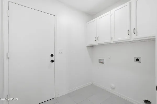 a view of an empty room and wooden floor