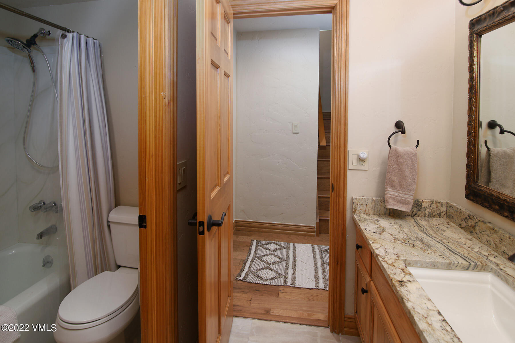 2875 Manns Ranch Road, Unit H3 Vail, CO 81657 - Photo 15 of 18 a bathroom with a granite countertop sink toilet and shower