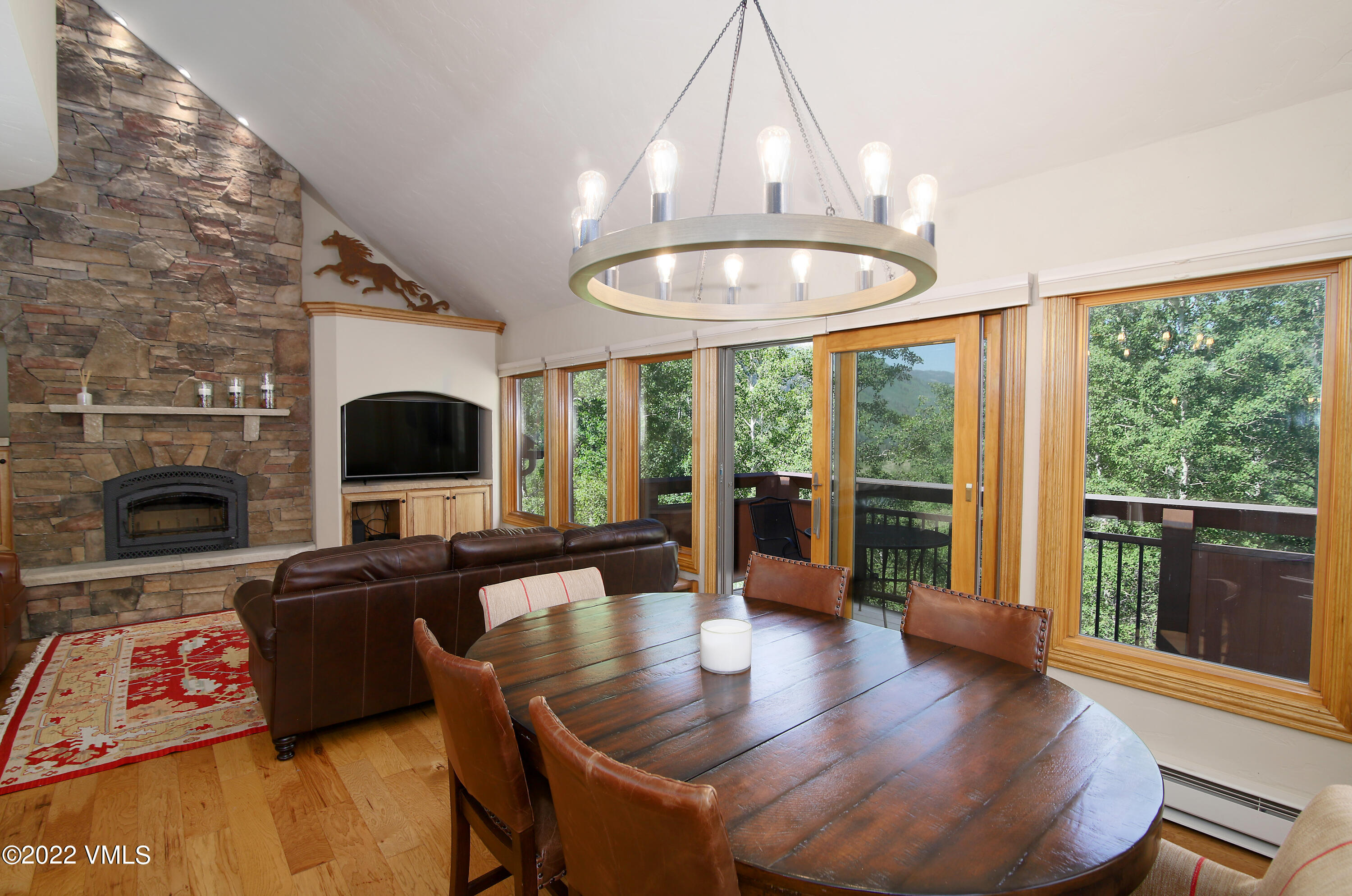 2875 Manns Ranch Road, Unit H3 Vail, CO 81657 - Photo 2 of 18 a living room with furniture and a fireplace