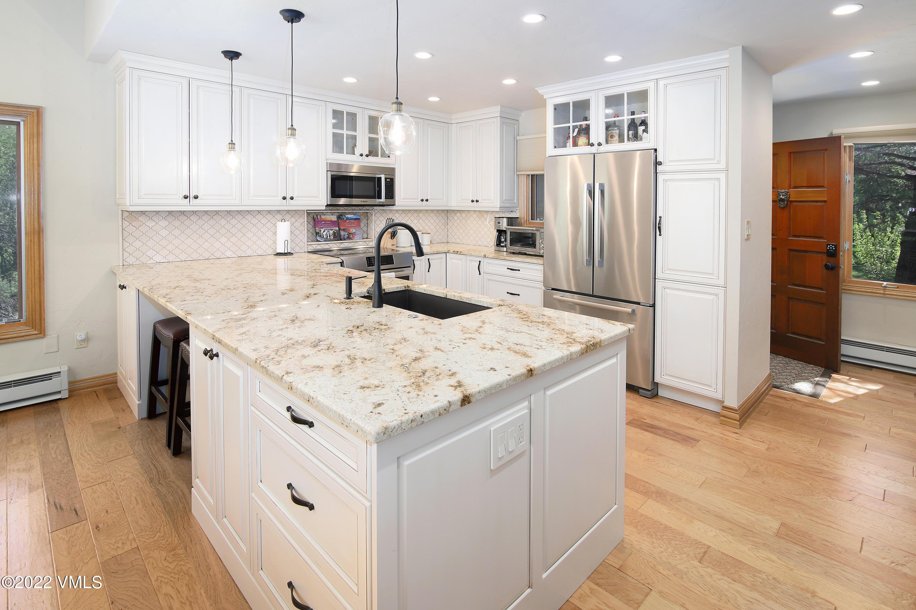 2875 Manns Ranch Road, Unit H3 Vail, CO 81657 - Photo 8 of 18 a kitchen with stainless steel appliances granite countertop a sink stove and refrigerator