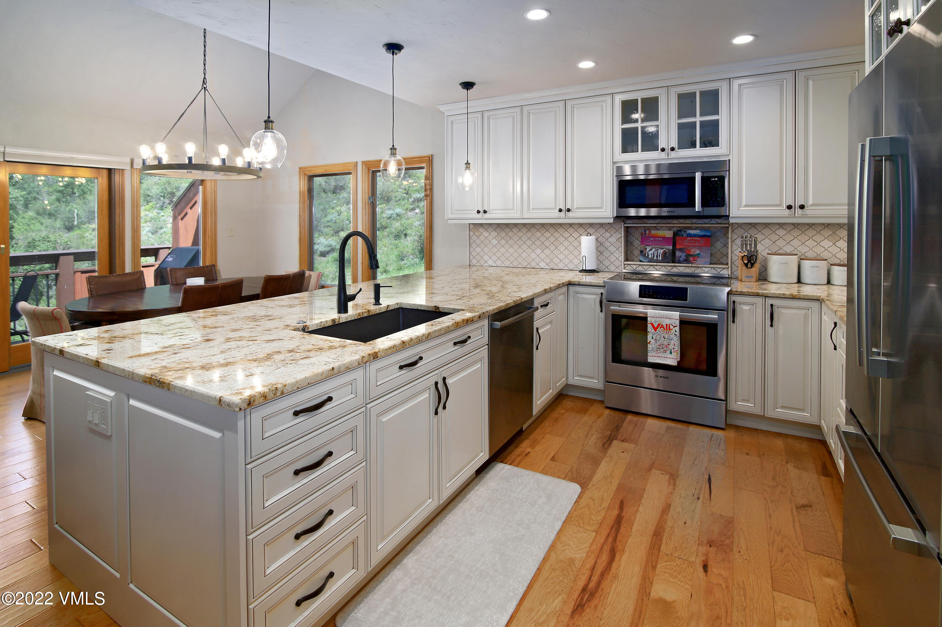 2875 Manns Ranch Road, Unit H3 Vail, CO 81657 - Photo 9 of 18 a kitchen with stainless steel appliances granite countertop a stove oven and a refrigerator