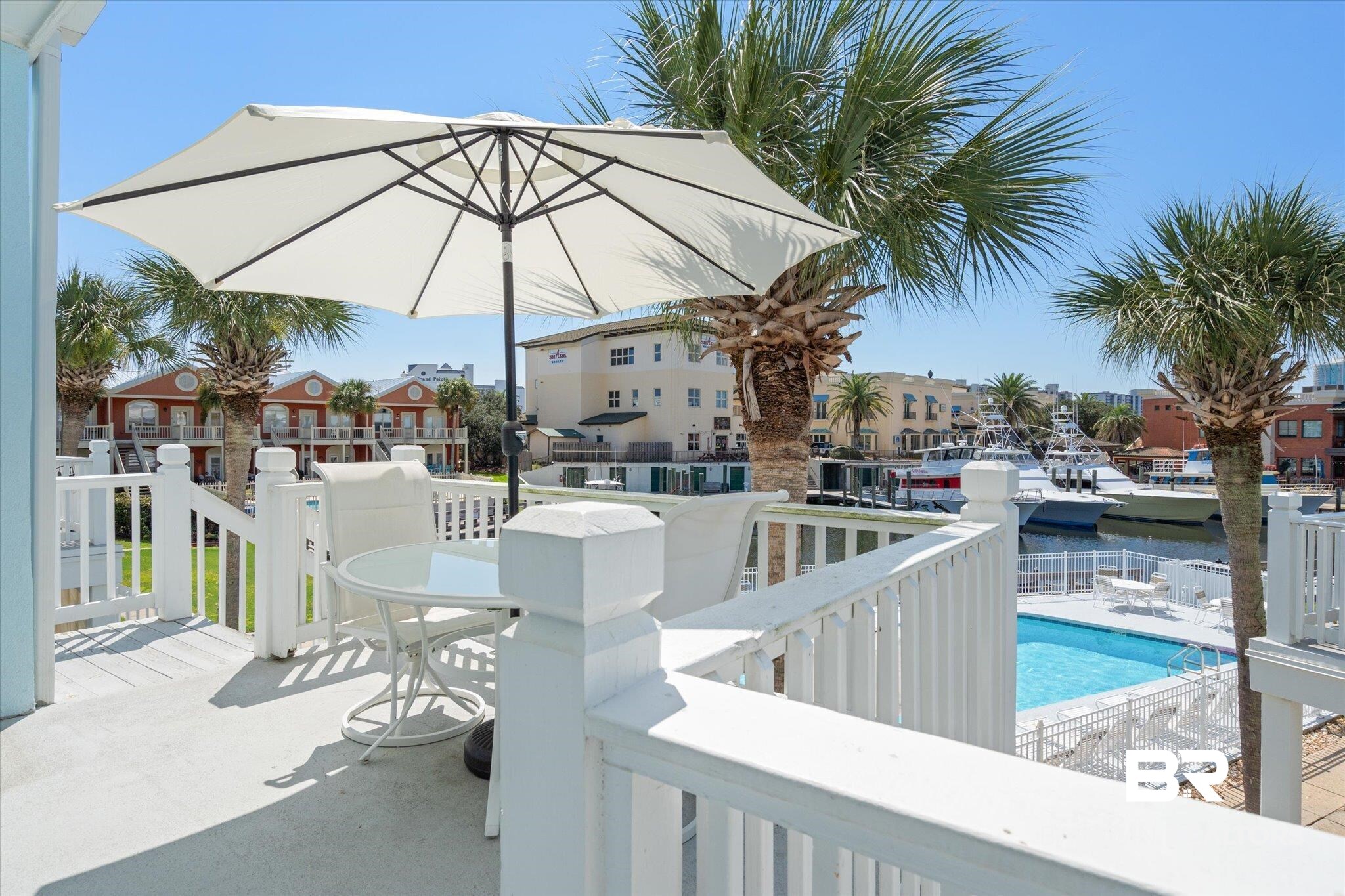 3575 Bayou Road, Unit A 10 Orange Beach, AL 36561 - Photo 3 of 31 View of patio / terrace with a water view and the complex pool