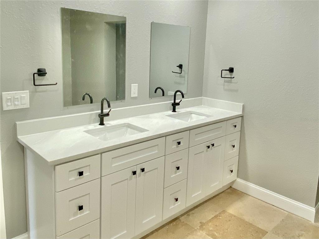 120 Grace Street Crystal Beach, FL 34681 - Photo 2 of 12 a bathroom with a sink and a mirror