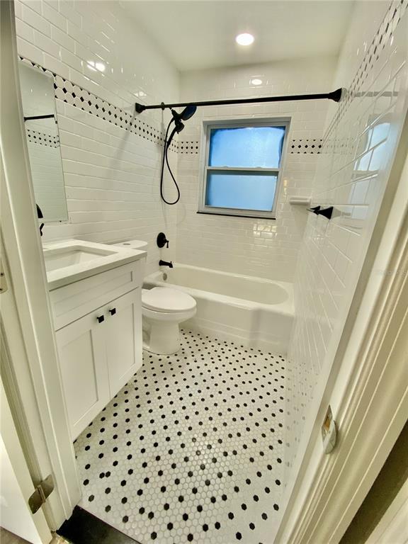 120 Grace Street Crystal Beach, FL 34681 - Photo 3 of 12 a bathroom with a shower toilet and a shower