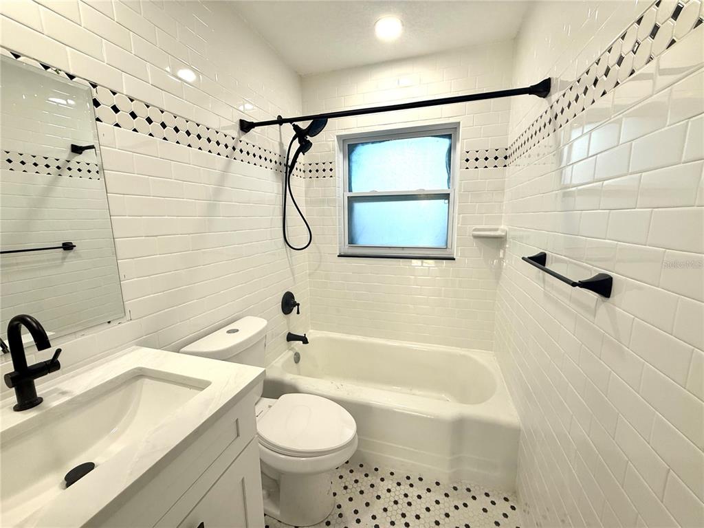 120 Grace Street Crystal Beach, FL 34681 - Photo 8 of 12 a bathroom with a sink a toilet and shower